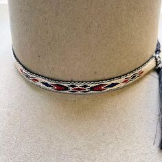 These western hatbands will definitely set off the western look on your favorite hat. Dress it up with this ½" tapestry hatband. The slip knots with end tassels easily adjusts for a snug fit. 
*Hat not included. Western Braided Hat Bands For Rodeo, Braided Western Hat Bands For Rodeo, Western Braided Hat Band With Flat Brim, Braided Western Hat Bands, Western Style Braided Hat Bands For Flat Brim, Adjustable Braided Western Hat, Western Style Adjustable Braided Hat, Western Braided Hat Band For Ranch, Adjustable Flat Brim Hat With Fringe