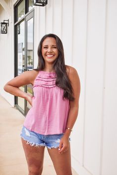 We are loving this top in a pink color, featuring a halter top and ruffle details Chic Ruffled Halter Top For Spring, Chic Spring Halter Top With Ruffles, Pink Ruffled Straps Tank Top, Feminine Ruffled Halter Top For Summer, Casual Ruffled Halter Neck Top, Chic Ruffled Halter Top, Casual Spring Halter Top With Ruffles, Feminine Ruffled Sleeveless Halter Top, Feminine Ruffled Halter Neck Top