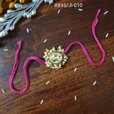 Exclusive Kundan Rakhi for Brother, Thread Pearl Bracelet, Celebrate Raksha Bandhan with Traditional Indian Rakhi, Rakhi Card (pack of 1) Length: Freesize Material: 100% cotton thread (soft thread) Package: pack of 1 Rakhi, also known as Raksha Bandhan, is a traditional Indian festival that celebrates the special bond between brothers and sisters. It is a joyous occasion where sisters tie a decorative thread called a rakhi around their brothers' wrists, symbolizing their love, protection, and th Adjustable Pink Bracelet For Diwali, Adjustable Kundan Bracelets For Festivals, Motif Bracelets For Diwali Gift, Diwali Gift Bracelets With Motifs, Gold Bracelets With Motifs For Gift, Gold Bracelet With Motifs As Gift, Gold Bracelets With Motifs As Gift, Adjustable Kundan Bracelet As Gift, Adjustable Meenakari Bracelets For Puja