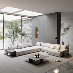 a modern living room with white furniture and large windows