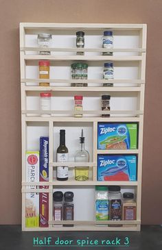 a shelf with spices and condiments on it