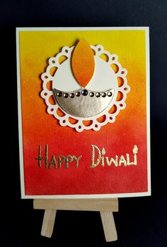 a happy diwali card with an orange and yellow background