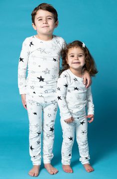 Sweet stars pattern these stretch-cotton pajamas with a longer-length top that means it won't ride up while baby is relaxing. This item is designed to fit snugly, as it is not flame-resistant 95% organic cotton, 5% spandex Machine wash, tumble dry Imported Long Sleeve Sleepwear With Star Print For Bedtime, Long Sleeve Sleepwear With Star Print, Long Sleeve Star Print Sleepwear, Star Print Long Sleeve Sleepwear For Pajama Party, White Family Matching Sleepwear, White Family Matching Sleepwear For Pajama Party, White Long Sleeve Tops For Sleepover, Star Print Long Sleeve Sleepwear For Loungewear, Family Matching White Sleepwear For Loungewear