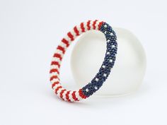 Unisex beaded bracelet in american flag colors The star and stripe bracelet is great for all patriotic occasions, especially 4th of July. If you are interested in a bracelet, please measure your wrist before choosing a size! Please select Your Wrist Size at checkout. This bracelet is made of highest quality Japanese Toho beads. Diameter 0.3 inch. (0.7 cm). Bracelet is 100 % handmade. This bracelet will be shipped within 3-5 business days.I carefully pack all items and ship them with registered A Gold Snake Jewelry, Snake Skin Bracelet, Patriotic Bracelet, Flag Beads, Pastel Earrings, Witch Necklace, Edgy Earrings, Crochet Beaded Bracelets, Festival Earrings