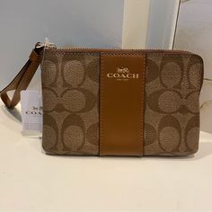 Coach. Corner Zip Wristlet. Saddle Brown. Nwt. Pet Friendly, Smoke Free Home. Brown Rectangular Bags With Wrist Strap, Brown Pouch Wristlet For On-the-go, Chic Brown Wristlet For Everyday Use, Brown Rectangular Wristlet For On-the-go, Brown Pouch Wristlet For Travel, Brown Clutch Wristlet For Travel, Brown Rectangular Wristlet For Everyday Use, Brown Clutch With Wrist Strap For Daily Use, Elegant Brown Wristlet For Everyday Use