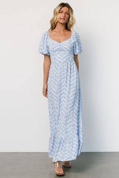 Make an appearance at Sunday brunch or garden parties with the Durban Maxi dress, crafted from flowy crepe chiffon with a charming dusty blue geometric pattern on an off-white backdrop. Featuring a wide sweetheart neckline, smocked back bodice, and lined balloon sleeves, it's both elegant and comfortable. Dress Dusty Blue, Blue Geometric Pattern, Max Dress, Knit Sweater Top, Baltic Born, Dress Dusty, Ivory Dresses, Chiffon Material, Garden Parties