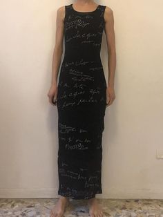 Super fun 1990s Kenzo Jeans sheer mesh black lace dress. Awesome 90s club kid style! Pair this with a back velvet choker and Dr Martin boots!The dress has a lot going on. The fabric is a nylon lace that has been printed with silver calligraphy signatures in French - It's hard to read and understand the words - go for you own interpertaion!Inset in the chest and at the knees are bands of sheer nylon mesh that have Kenzo Jeans printed on top. There is a sheer black slip to be worn underneath. Labe Grunge Style Fitted Party Dress, Fitted Grunge Party Dress, Black Grunge Party Dress, Grunge Fitted Dress For Night Out, Fitted Grunge Dresses For Night Out, Grunge Fitted Party Dress, Summer Party Grunge Dress, Summer Grunge Party Dress, Sleeveless Grunge Party Dress