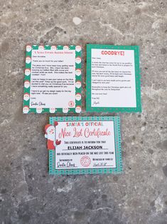 two pieces of paper with santa's list attached to them sitting on the ground