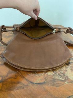 "Vintage Brown Leather purse, shoulder bag, 1970s, slightly distressed, Boho purse, Whiskey brown, Hippie purse Nice solid all leather 1970s brown leather purse Good condition, sound construction some light marks on the back. No damage Flap over closure 3 seperate sections. 1 zippered 1 center 1 large main section Measurements: 9\" x 13\" x 3\" Strap drop: 15\" NK528DR Vintage Brown Leather purse, shoulder bag, 1970s, slightly distressed, Boho purse, Whiskey brown, Hippie purse" Hippie Purse, Boho Purse, Brown Leather Purse, Boho Purses, Leather Purse, Vintage Brown, Saddle Bags, Leather Purses, Whiskey