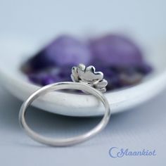 This nickel-free Sterling Silver ring features a dainty sunflower that measures 9 mm in width. The band is 1.5 mm wide and has been carefully curved for comfortable wear. This ring makes a wonderful addition to your stacking ring collection, a great pinkie ring, or a wonderful encouragement gift. The sunflower has many meanings across the world. Different cultures believe it means anything from positivity and strength to admiration and loyalty. In Chinese culture, sunflowers are said to mean goo Pinkie Ring, Encouragement Gift, Sunflower Ring, Different Cultures, Encouragement Gifts, Ring Collection, Ring Sizer, Onyx Ring, Pinky Ring