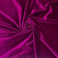 a close up shot of the purple fabric that is very soft and shiny in color