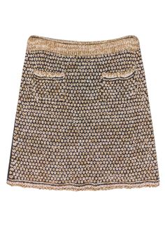 Complement your wardrobe with this Chanel classic tan knit skirt, beautifully crafted to reflect the brand's iconic elegance. The gold chain detailing adds a touch of sophistication, making this piece a perfect blend of modern and timeless design. For a stylish and harmonious look, pair this skirt with its matching Chanel blazer, a silk camisole, and elegant pumps. Size 36 Shell 76% Rayon 24% Nylon Lining 86% Silk 14% Elastane Two front patch pockets w/ gold-toned textured “CC” buttons Waist 29” Luxury Fitted Gold Skirt, Elegant Gold Skirt For Fall, Elegant Gold Lined Skirt, Chic Gold Mini Skirt, Gold Skirt For Spring Formal Occasion, Chic Gold Skirt For Fall, Gold Lined Pencil Skirt, Gold Skirt For Fall Evening Events, Gold Skirt For Evening Fall Events