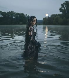 a woman with long hair in the water