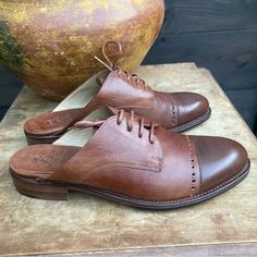 Angela Scott Oxford Brogue Loafer Slides Brown Size 11. Totally On Trend For This Season! Slight Heal (Just Under An Inch.) Lace-Up. Slight Intentional Color Contrast Between The Shoe Base And Tips. In Excellent Condition - A Small Amount Of Wear In The Heals, Otherwise Extremely Clean Throughout. Thank You For Shopping My Closet. I Search For Special, Unique, And Rare Items To Accent Your Wardrobe And Home, Bringing Them To You At Prices That Make Them Accessible. As A Trained Photographer, To The Degree Possible, I Work To Match Colors, Reflect The Actual Item, And Note Any Flaws. Like Anyone Else, I'm Not Perfect. But I Do Go To Great Lengths To Illustrate And Sell The Best Items. After Shoe Base, Loafer Slides, Office Of Angela Scott, I'm Not Perfect, Rare Items, Oxford Brogues, Match Colors, Great Lengths, Color Contrast