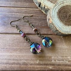 Crystal earrings boho rainbow tourmaline handmade purple round dangle bronze boho style festival gift her unique jewelry earrings for women Earrings for women. Yes, please. I love to rock a great pair of earrings. Stone, crystal, lampwork, beaded earrings, well I love all of them! These earrings have 18mm rainbow crystal faceted round drops, 6mm tourmaline gemstone, 4mm Swarovski Crystal aurora beads, bronze findings and ear wire. Can't find your stone or color? I specialize in hard to find uniq Bohemian Brass Crystal Earrings With Ear Wire, Bohemian Iridescent Jewelry With Ear Wire, Multicolor Bohemian Crystal Earrings, Bohemian Wire Wrapped Round Crystal Earrings, Handmade Bohemian Brass Crystal Earrings, Bohemian Iridescent Earrings With Ear Wire, Bohemian Wire Wrapped Bronze Earrings, Bohemian Bronze Wire Wrapped Earrings, Bohemian Iridescent Dangle Earrings