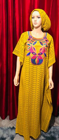 This stunning long dress with camiso for party is a must-have for any fashion-forward woman. Made from high-quality dry lace material, this dress features intricate embroidery that adds a touch of elegance to the already beautiful design. The dress comes in a vibrant yellow colour that perfectly complements the traditional Nigerian/African style. The dress is one size regular and is suitable for women of all shapes and sizes. It is perfect for any occasion, whether you are attending a party, a w Intricate Embroidered Tunic Dress For Festivals, Festival Dress With Multicolor Chikankari Embroidery, Fitted Chikankari Embroidery Maxi Dress, Fitted Maxi Dress With Chikankari Embroidery, Floor-length Dresses With Intricate Multicolor Embroidery, Floor-length Lace Dresses For Spring, Festive Maxi Length Dress With Lace Work, Party Floor-length Kaftan With Floral Embroidery, Traditional Floor-length Dress With Lace Work