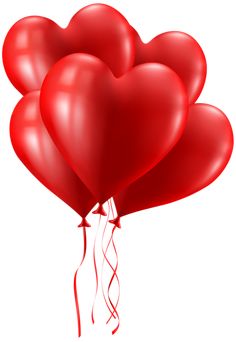 red heart shaped balloons floating in the air