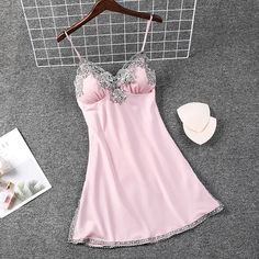 Shipping: Worldwide Express Shipping AvailableDelivery time: 7-15Days Fast ShippingReturns: Fast refund, 100% Money Back Guarantee.SPECIFICATIONSBrand Name: QIANTANGMaterial: POLYESTERMaterial: rayonOrigin: Mainland ChinaCN: JiangsuSexually Suggestive: NoDresses Length: Above Knee, MiniObscene Picture: NoItem Type: NightgownsSeason: summerCollar: Spaghetti StrapMaterial Composition: Satin LacePattern Type: PatchworkGender: WOMENSleeve Length(cm): sleevelessModel Number: Y23102304Thickness: normalDecoration: LaceSeason: Spring , Summer , AutumnOccasion: Home Wear , Sleepwear , NightgownFeature: Sexy , Casual , Soft , IntimateWash Method: Wash By Hand Spaghetti Straps Chemise With Built-in Bra For Wedding Night, Wedding Night Chemise With Spaghetti Straps And Built-in Bra, Pink Cami Sleepwear For Night, Pink Chemise With Spaghetti Straps For Night, Pink Spaghetti Strap Chemise For Wedding Night, Spaghetti Strap Nightgown With Built-in Bra For Wedding Night, Summer Wedding Nightgown With Built-in Bra, Pink Camisole Dress For Night, Pink Summer Night Chemise