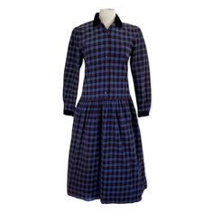 Vintage Lanz Originals Blue Plaid Corduroy Dress Made in the USA 100% Cotton Blue, black and red plaid Long sleeves Drop waist Midi skirt with pockets Button front Prairie/Cottagecore Aesthetic Edwardian Revival Bust 37" Waist 34" Length 46.5" Collared Cotton Plaid Dress, Plaid Long Sleeve Dress For Daywear, Plaid Button-up Dress For Fall, Fall Button-up Plaid Dress, Fall Plaid Button-up Dress, Plaid Dress With Button Closure For Work, Fall Plaid Dress With Buttons For Work, Plaid Cotton Dress With Buttons, Classic Plaid Dress With Buttons