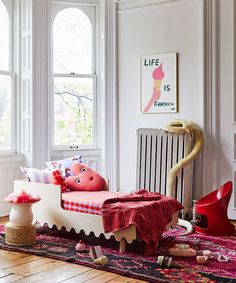 a room with a bed, radiator and other items on the floor