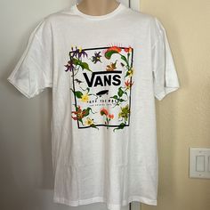 Vans Size: Men’s Large White W/Floral Beautiful Colors Awesome T-Shirt Ioffers! White Cotton Vans T-shirt, Vans Crew Neck T-shirt For Spring, Vans Letter Print T-shirt For Summer, White Vans T-shirt With Graphic Print, Vans White T-shirt With Graphic Print, Vans Spring Crew Neck T-shirt, Vans White Crew Neck T-shirt, White Vans T-shirt For Summer, White Short Sleeve Vans Tops