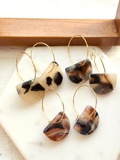 These semicircle tortoiseshell hoop earrings are handcrafted from lightweight polymer clay. ~ CARE INSTRUCTIONS ~ Polymer clay is durable and slightly flexible, but at the same time must be handled with care. May break if dropped or handled improperly. Keep away from moisture, and avoid contact with perfume and other aerosols. Store items safely in a cool, dry place. Use a damp cloth to wipe away any residue or dust. *Please note that slight variation in color and form may occur compared to the Polymer Clay Jewelry Diy, Earrings Hoops, Clay Jewelry Diy, Saint Louis, Jewelry Earrings Hoops, Polymer Clay Jewelry, Tortoise Shell, Clay Jewelry, Polymer Clay Earrings