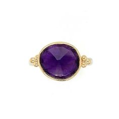 One of the most vibrant Amethysts we have come across, this rosecut gem is set in 14k yellow gold with gold accent beads, and a sterling silver freeform band. Approx stone size: 12mm x 10mm Approx ct weight: 3.2cts Mohs hardness: 8 This one of a kind piece is handmade with love in Emily's Hudson Valley studio. If you have questions about sizing, shipping or need help deciding on your perfect piece please reach out to us! Heirloom Amethyst Rings With Gemstone Accents, 14k Gold Faceted Birthstone Ring, Anniversary Rondelle Gemstone Jewelry, Heirloom Amethyst Jewelry As Birthstone, Gold Sapphire Ring In Sterling Silver, Luxury Sterling Silver Stackable Rings With Gemstones, Yellow Gold Sterling Silver Birthstone Ring With Round Stone, Fine Jewelry Amethyst With Bezel Setting, 14k Gold Faceted Ring