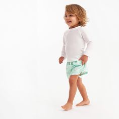 These two swim trunks are just what your little guy needs to have a blast on a sunny day of water fun. Whether you're on a beach getaway, chilling by the pool, or having water adventures at home, these swim trunks keep your baby boy or toddler boy protected from the sun with UPF 50+ fabric and let him move comfortably thanks to the stretchy waistband. Plus, they're a breeze to clean in the washing machine, so you can quickly get ready for the next adventure after each exciting day of play! Our e Playful Swim Trunks With Uv Protection For Pool, Playful Swim Trunks With Upf 50+ For Vacation, Casual Rash Guard With Uv Protection For Playwear, Playful Summer Rash Guard With Upf 50+, Playful Swim Trunks With Upf 50+, Playful Swim Trunks With Built-in Shorts, Playful Upf 50+ Swim Trunks For Playwear, Playful Rash Guard With Uv Protection For Playtime, Playful Shorts For Beach Season And Pool