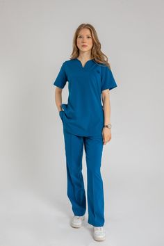 💉 Elevate your professional style with our Women's Orchid Fillet Pocket Set! ️ Designed for comfort and functionality, this set includes a Tippet scrub top and matching scrub dress, perfect for nurses, healthcare professionals, and medical staff. 💼 Crafted from high-quality materials, our scrubs offer durability and ease of movement throughout your busy day. 🏥 Whether you're working in a hospital, clinic, or medical office, our uniform set ensures you look and feel your best while providing exceptional patient care. 💊 Available in a range of sizes and colors, our scrub set combines practicality with style, making it a must-have addition to your medical wardrobe. 💕 Invest in quality attire that reflects your dedication to healthcare with our Women's Orchid Fillet Pocket Scrub set today Best Scrubs Uniform For Women, Scrub Dress, Nursing Style, Healthcare Uniforms, Hospital Clinic, Nurse Scrubs, Scrubs Dress, Scrubs Uniform, Hospital Staff