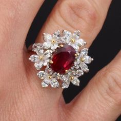 Luxury Ruby Cluster Ring With Diamonds, Luxury Cluster Ruby Ring With Diamonds, Luxury Ruby Cluster Ring, Luxury Ruby Marquise Cut Rings, Luxury Ruby Cluster Ring With Center Stone, Luxury Cluster Ruby Ring With Center Stone, Platinum Ruby Ring With 17 Jewels, Formal Cluster Ruby Ring, Elegant Marquise Ruby Ring With Vvs Clarity