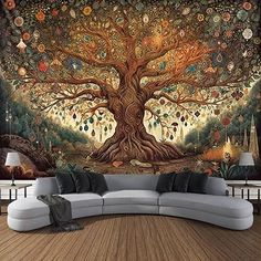 a living room with a large tree mural on the wall and couch in front of it