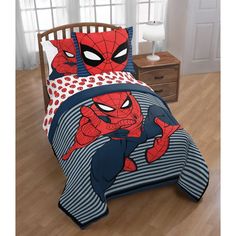 a spiderman bed set with blue and red sheets