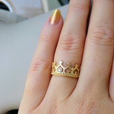 Beautiful Crown ring with a diamond in the center. Will make every girl feel like a Queen. This ring in a crown shape elegant piece is full of air, romantic and beautiful. A 14k yellow gold ring, set with a beautiful 7 point white and very clear diamond. Can be a unique engagement ring or just a sweet gift.  * Solid 14k gold (yellow / white / rose) * 1 white 3mm diamonds * Packed in a beautiful gift box * Worldwide shipping Each piece is made to order and can be customized to your taste with oth Queen Ring Design Gold, Gold Crown Shaped Diamond Ring, Gold Crown-shaped Diamond Ring, Elegant Rings With Crown Design, Gold Diamond Ring With Crown Design, Crown Shaped Diamond Wedding Ring With Prong Setting, Elegant Round Crown Anniversary Ring, Crown Shaped Ring With Prong Setting For Promise, Luxury Crown Promise Ring