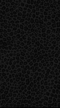 an animal print pattern in black and grey colors on a dark background with the word,