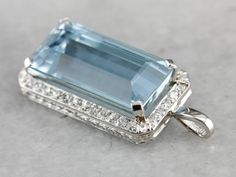 Aquamarine is a popular stone for its beautiful, watercolor hue. This emerald cut gem is an icy, sky blue with hints of deeper greens within its depths! The surrounding diamonds bring plenty of light into this simple, easy to wear, etched platinum pendant. This pendant does not come with the chain shown. Please feel free to contact us, we will help you find the perfect chain for your style and budget! Metal: Platinum Gem: Aquamarine 3.83 Carats Gem Measurements: 19.7 x 9.9 mm, Emerald Cut Accent Luxury Platinum Gemstones For Gift, Luxury Brilliant Cut Aquamarine Jewelry, Luxury Aquamarine Jewelry In Diamond White, Luxury Aquamarine Jewelry With Natural Stones, Luxury Silver Aquamarine Jewelry, Luxury Aquamarine Birthstone Jewelry, Luxury Aquamarine Gemstones For Gifts, Luxury Aquamarine Fine Jewelry, Luxury Aquamarine Gemstones