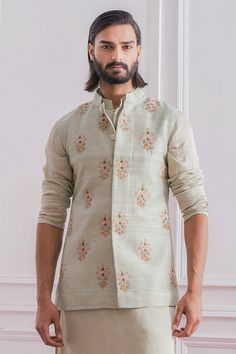 Mint green Nehru jacket with floral intricate hand embroidery and mandarin collar.
Component: 1
Pattern: Embroidered
Type Of Work: Floral
Neckline: Mandarin
Sleeve Type: Sleeveless
Fabric: Raw Silk, Cotton Silk
Color: Green
Other Details: 
Hand embroidery
Closure: Front concealed buttons
Note: Inner kurta and churidar worn by the model is not for sale
Occasion: Sangeet,Mehendi - Aza Fashions Long Sleeve Sherwani With Floral Embroidery For Reception, Reception Sherwani With Floral Embroidery And Long Sleeves, Floral Embroidered Sherwani For Reception With Long Sleeves, Designer Bandhgala For Spring With Long Sleeves, Pista Green Bandhgala With Intricate Embroidery For Diwali, Long Sleeve Floral Embroidery Kurta For Reception, Diwali Embroidered Pista Green Bandhgala, Festive Pista Green Bandhgala With Intricate Embroidery, Designer Nehru Jacket With Floral Embroidery For Festive Occasions