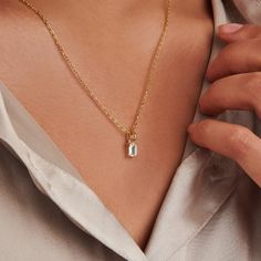 A dainty stone and delicate metallic chain are combined to create this Gold Pendant Necklace in stellar moissanite, your new favorite wear-anywhere accessory.   The birthstone for the month of April is Diamond. Moissanite is referred to as a Diamond simulant. Moissanite disperses light very well and has higher light refraction than Diamond and will appear more brilliant.  Lab-created moissanite stone; Made of 14K gold plated sterling silver.  Pendant size: 4mm x 6mm with 18" chain.   Hypoallerge Gold Birthstone Necklace, April Birthstone Necklace, Birthstone Charm Necklace, Light Refraction, Moissanite Pendant, September Birthstone Jewelry, Necklace For Her, Moissanite Necklace, August Birthstone Jewelry