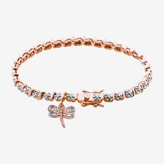 This elegant Sparkle Allure women's S-link diamond accent tennis bracelet features a dragonfly charm and makes a beautiful addition to any jewelry wardrobe. Hand-crafted in rose gold over bronze and contains a genuine diamond accent to enhance the design and appearace. The 7.25" bracelet includes a tongue in groove clasp and double figure 8 safety catch. This show stopping piece made as the perfect essential for your daily outfit and is sure to leave an impression.Features: In A Gift Box, Nickel Rose Gold Cubic Zirconia Tennis Bracelet Gift, Anniversary Rose Gold Tennis Bracelet With Diamond Accents, Adjustable Rose Gold Tennis Bracelet For Anniversary, Rose Gold Round Tennis Bracelet As Gift, Bracelets Tennis, Jewelry Wardrobe, Dragonfly Charm, Figure 8, Tennis Bracelet