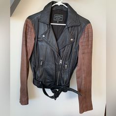 Black And Brown Real Leather Moto Jacket With Stitch Detailing. This Jacket Was Worn Only A Couple Of Times And Is In Excellent Condition. 100% Leather Size Women’s Xs Edgy Brown Leather Biker Jacket, Brown Moto Leather Jacket For Work, Edgy Fitted Brown Outerwear, Edgy Brown Workwear Outerwear, Edgy Brown Outerwear For Work, Leather Moto Jacket Womens, Leather Moto, Leather Moto Jacket, Moto Jacket