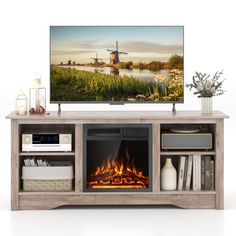 an entertainment center with a fire place and a television on it's stand, in front of a white background