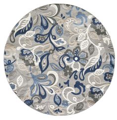 a round rug with blue and gray flowers on it, in the middle of a white background