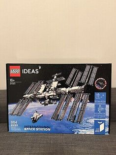 the box for legos international space station is open and ready to be played in