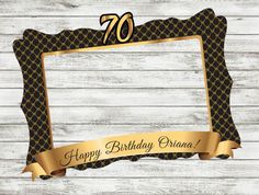 a 70th birthday frame with the number seventy on it and gold ribbon around the edges