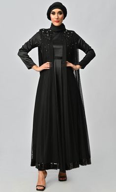 HURRAY!!!Here your wait has ended please find with EASTESSENCE exclusive and more embellished designer dresses. Now it's time to update your wardrobe collection and feel unique on this Eid with our royal and classic dresses. Dress has a Round-neck, full sleeves with beautiful net detailing on back and shoulder and elegant machine, hand embroidery detailing Hijab is included Size & Fit:- The model (height 5'8") is wearing a size S Abaya length we will provide Material & Care:- Material: net and s Elegant Formal Abaya For Fall, Fitted Floor-length Embellished Abaya, Embellished Fitted Abaya For Party, Elegant Fitted Abaya For Fall, Embellished Fitted Party Abaya, Elegant Fitted Black Abaya, Elegant Fitted Fall Abaya, Elegant Floor-length Fall Abaya, Elegant Abaya With Sequins For Party