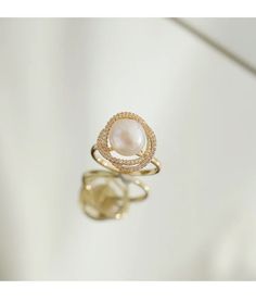 Live your vintage inspired dreams with our pearl and diamond ring. With the pearl bead in the middle and CZ Diamonds surrounding this is the perfect romantic gift for an engagement ring.• Material: High Quality 14K Gold Plated• Finish: 14K Gold Pearl Ring With Diamond Accents, Elegant Diamond Pearl Promise Ring, Elegant Diamond Pearl Ring For Promise, Elegant Open Pearl Ring For Anniversary, Luxury Pearl White Pearl Ring For Wedding, Wedding Pearl Open Ring, Luxury Wedding Rings With Pearl Drop, Open Pearl Ring For Wedding, Elegant Rose Gold Open Pearl Ring