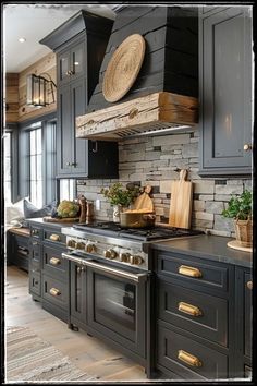 a kitchen with gray cabinets and wood accents