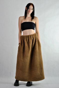 This is our no. 131 of Conscious Clothing Concept. This is a long maxi sheep's wool skirt that will keep you warm during the coming cold winter.  The pockets are placed in the side seams so you can keep your hands warm as well. It is the ultimate warm fabric for cold weather as it breathes and not allows body to sweat. Please be aware that this skirt will not look slimming :) Please write me a note if you would like any other colour from our fabric options, using a number or a name of a colour o Brown Long Skirt Bottoms For Winter, Brown Long Skirt For Winter, Brown Wide Leg Winter Skirt, Long Skirt With Pockets For Winter, Winter Long Skirt With Pockets, Brown Lined Skirt For Winter, Winter Bottoms With Pockets, Long Skirt Style, Brown Winter Skirt, Winter Brown Lined Skirt