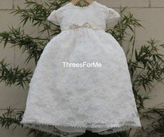 Our Erica Baptism dress is not only beautiful it's also our most popular. Our  baptism dress is completely laced front and back and there are pearls sewn in between the flower design on the lace.  Ankle length which means you little ones toes will show. Lace cap sleeves perfect for summer weather, fully lined for extra comfort.  Build in tulle net  to add fullness.  Beautiful matching lace bonnet.  Middle flower decorations are all handmade and removable.CareDry clean only Refunds/ ExchangeIf yo Lace Bonnet, Candle Kits, Baptism Gown, Baptism Candle, Girl Christening, Baptism Dress, Christening Dress, Baptism Girl