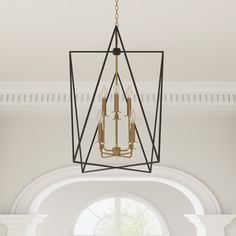 a chandelier hanging from the ceiling in a room with arched windows and white walls