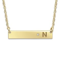 Create a meaningful gift or a cherished keepsake and inscribe your favorite initial onto this sleek women's bar pendant necklace, punctuated with a brilliant diamond accent. Fashioned in 14K yellow gold, the 18-inch rope chain secures in place with a spring ring clasp. Free personalization! Please provide one initial for this item if you wish to personalize it. Yellow Gold Nameplate Initial Necklace, Gold Initial Necklace With Single Diamond For Gifts, Classic Initial Necklace With Single Diamond, Classic Initial Necklace With Single Diamond For Gift, Classic Personalized Diamond Necklace For Anniversary, Personalized Classic Diamond Necklace For Anniversary, Classic Personalized Yellow Gold Diamond Necklace, Elegant Rectangular Pendant Initial Necklace For Anniversary, Classic Diamond Accented Bar Necklace For Anniversary